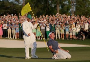 AUGUSTA, GEORGIA - APRIL 13: (R-L) Rory McIlroy of Northern Ireland celebrates winning with caddie Harry Diamond after the playoff hole during the final round of the 2025 Masters Tournament at Augusta National Golf Club on April 13, 2025 in Augusta, Georgia. (Photo by Andrew Redington/Getty Images)